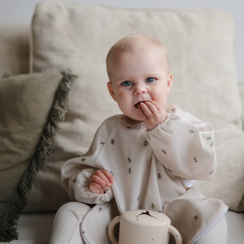 Mushie bib ar piedurknēm Blush