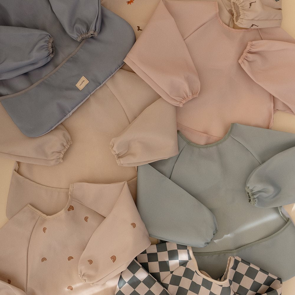 Mushie bib ar piedurknēm Blush