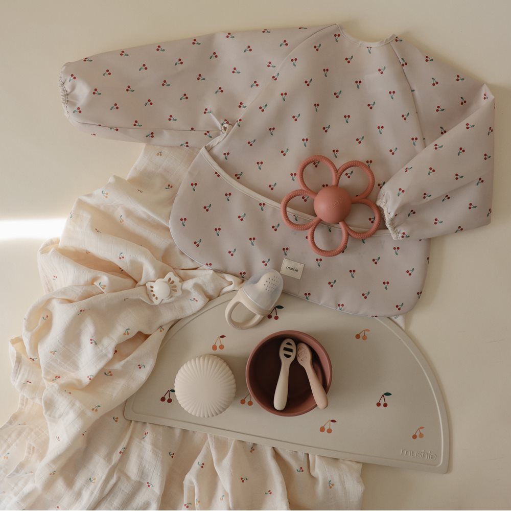 Mushie bib ar piedurknēm Blush