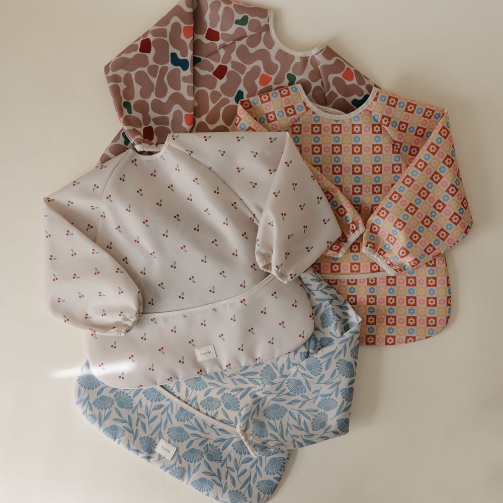 Mushie bib ar piedurknēm Blush