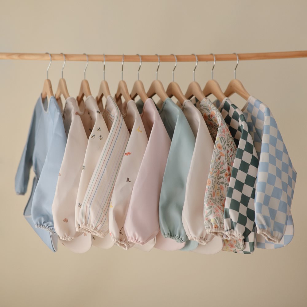 Mushie bib ar piedurknēm Blush