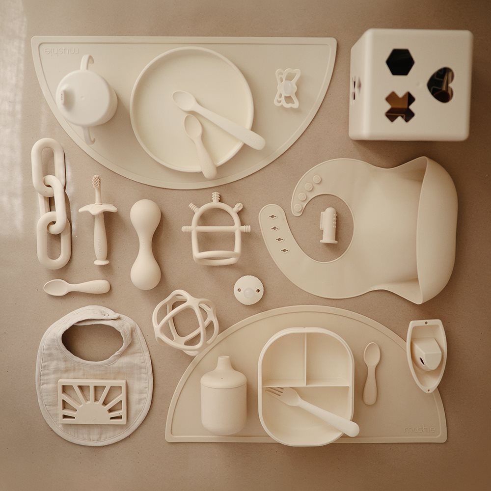 Mushie silikona košļājamā bumbiņa Shifting Sand