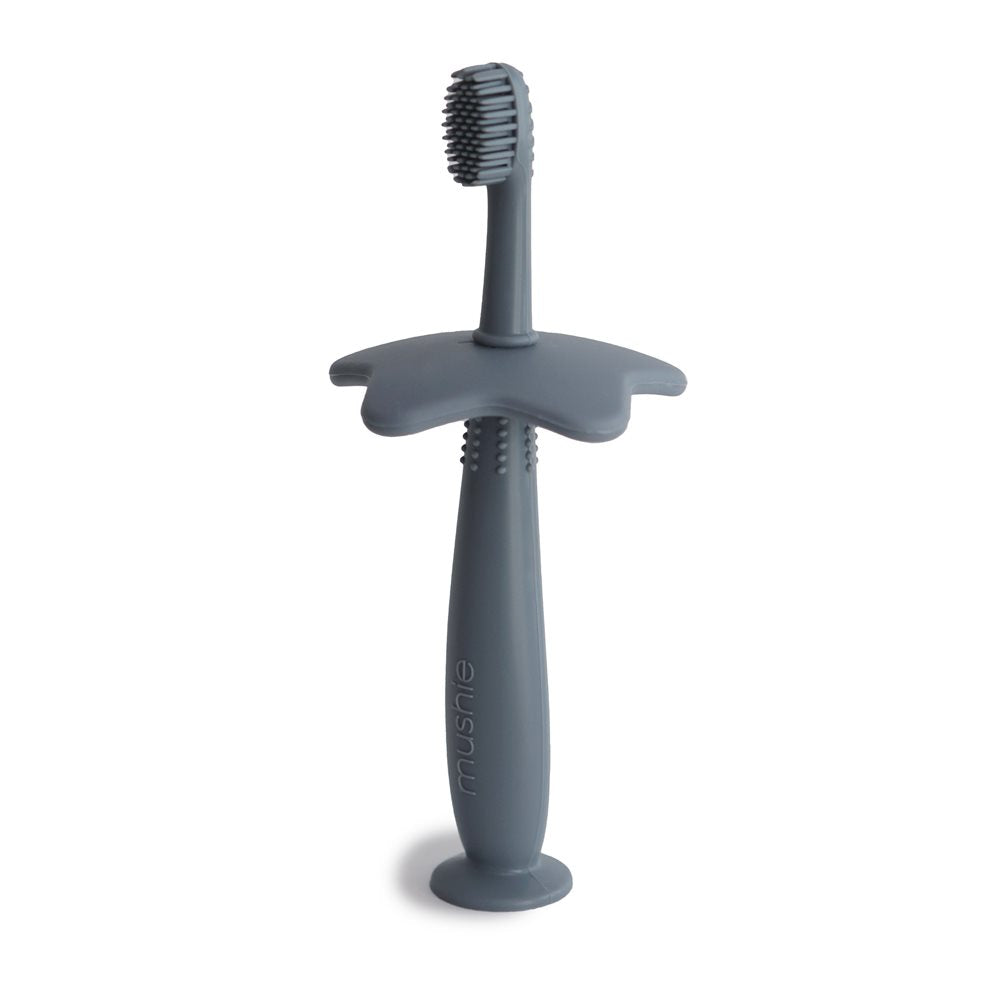 Mushie izglītojoša silikona zobu birste (Tradewinds)