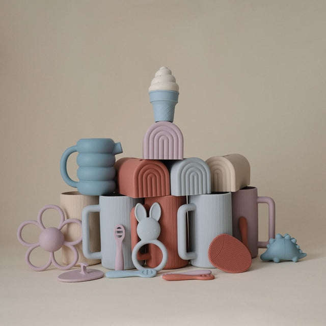 Mushie izglītojoša silikona zobu birste (Shifting Sand) 