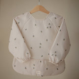 Mushie bib ar piedurknēm Blush