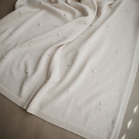 Mushie trikotāžas sega Textured Dots Baby Blanket (off White Melange) 