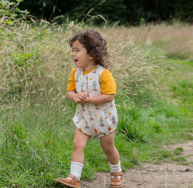 Mazo zaļo radikāļu kombinezons "Take to the Skies" - bēšs